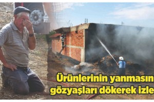 Ürünlerinin yanmasını gözyaşları dökerek izledi